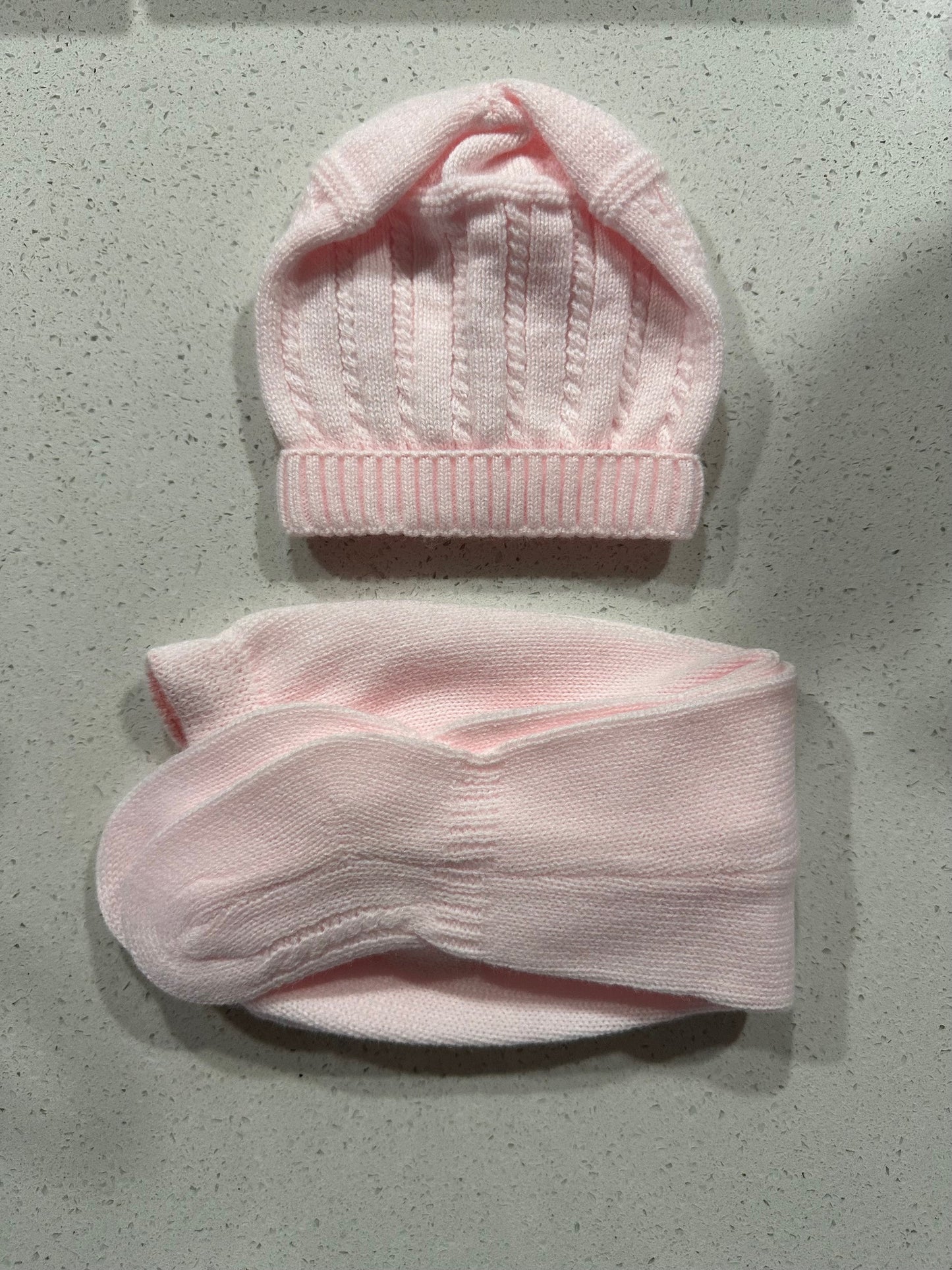 Set de punto rosa bebé.